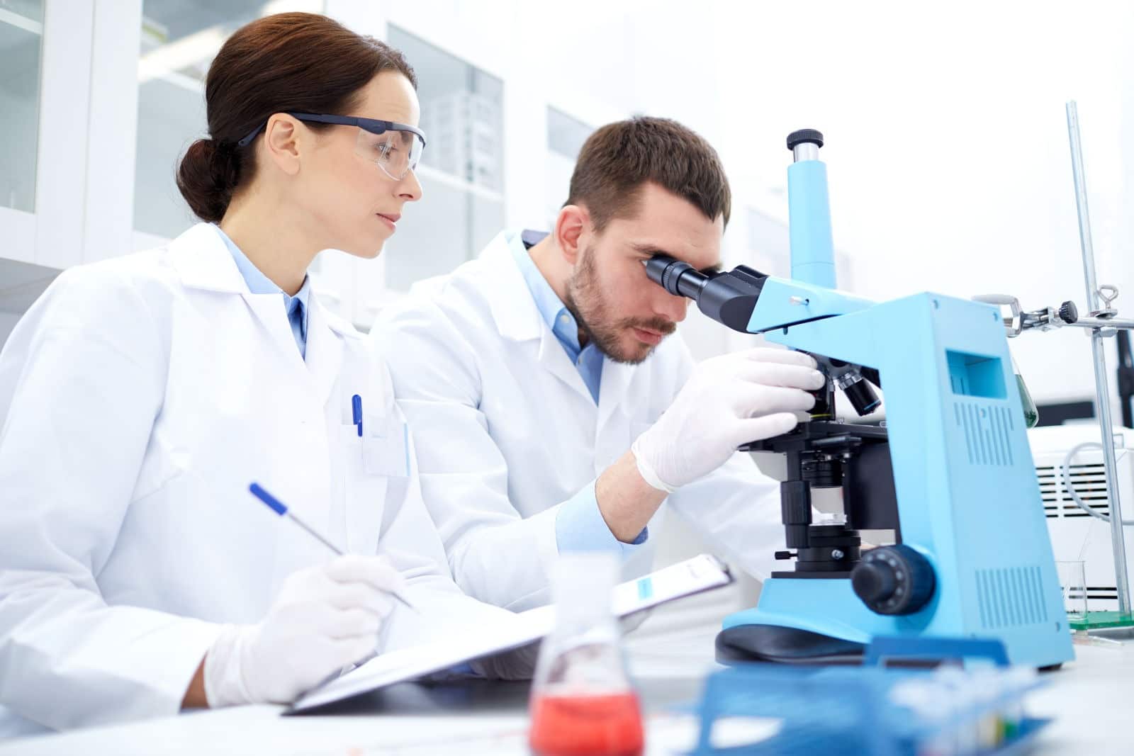 Researcher examining stem cell cultures in the laboratory